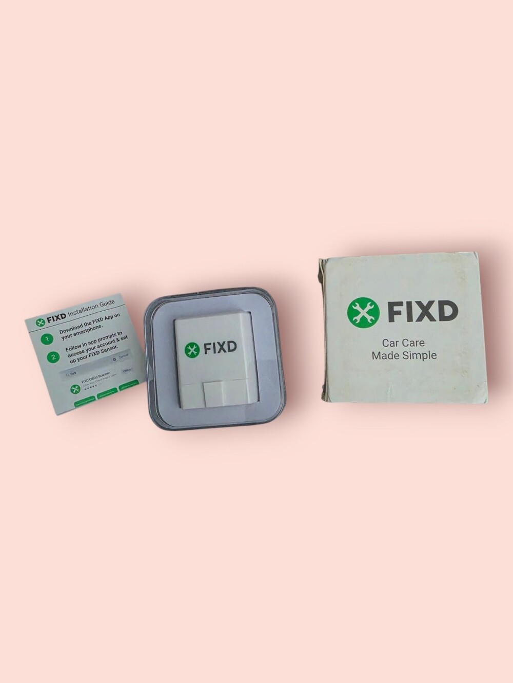 ^ FIXD OBD-II Car Diagnostic Sensor - White with Green Logo
